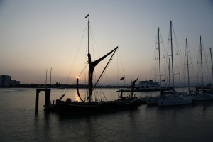 A Thames Barge silhouetted in the sunset at Gunwharf Marina, Portsmouth