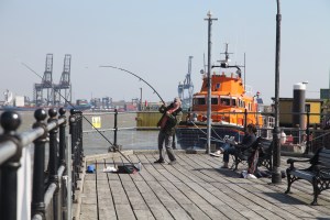 A fisherman trying to land a big fish at Ha'penny Pier this morning - it got away!