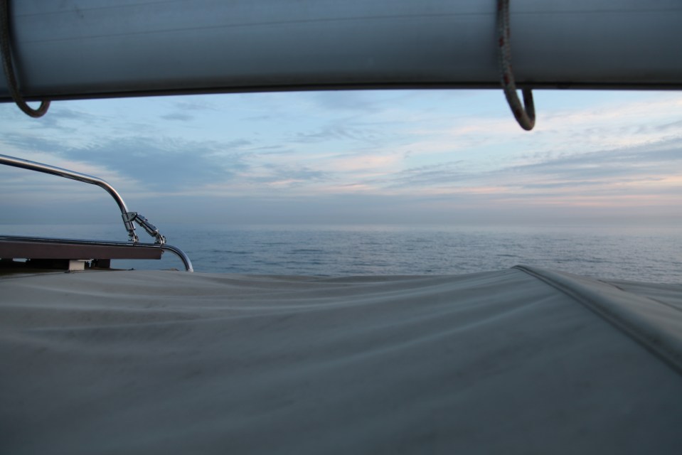 The colour of the sea blended into the sky as dusk approached